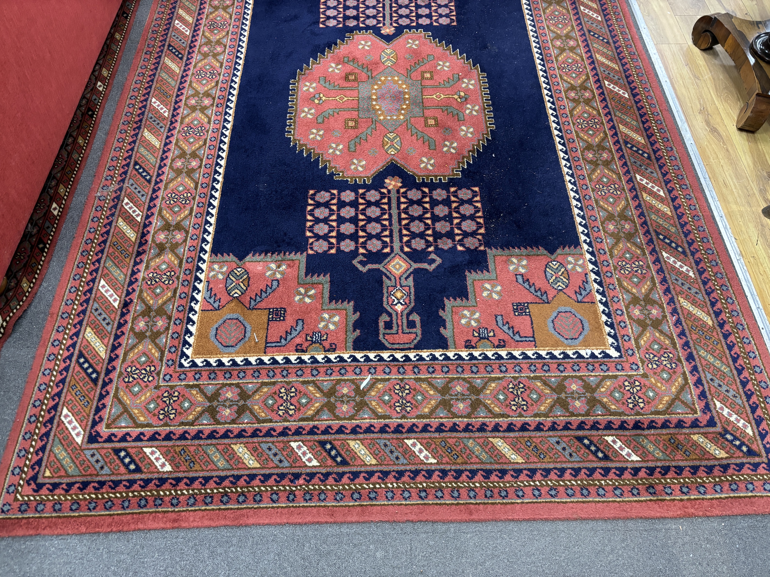 A North West Persian style machined blue ground carpet together with a similar runner, larger 295 x 190cm